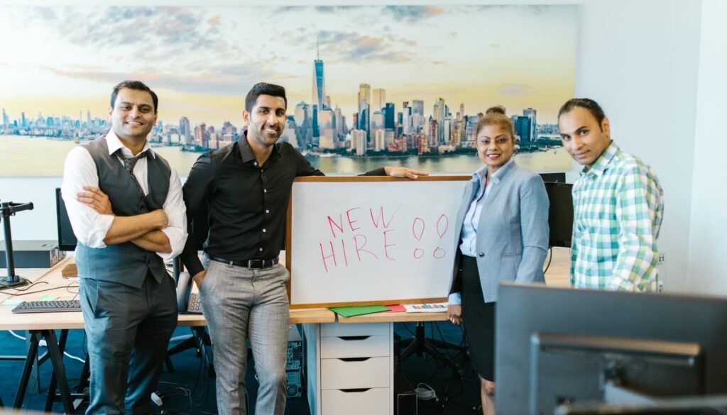 people standing beside a whiteboard